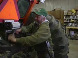 MS Farmer using wrench to tightening bolts on farm planter / Chelsea Michigan Stock Footage