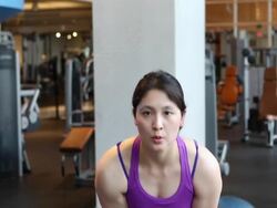 Woman at gym, performing resistance exercises with weights. Stock Footage