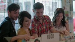 Group of friends sort through vinyl in Austin record store Stock Footage