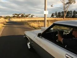 Muscle car driving in the country (24P HD) Stock Footage
