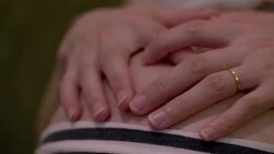 CU,Hands of pregnant woman caressing her belly. Stock Footage