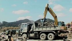 Recovery work continues in area where hundreds of bodies were found News Clip