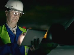 Engineer using tablet at industrial, oil or gas plant. Stock Footage