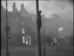 Buildings in Warsaw burn as Hitler's army invades Poland. News Clip
