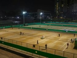 WS T/L View of people playing tennis in tennis court of Banpo sports complex at night / Seoul, South Korea Stock Footage