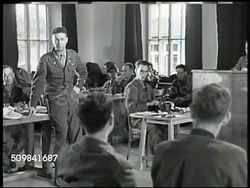 1945: MILITARY TRIBUNAL: STRASSER: MS Prosecutor Victor Miles standing asking about victims. MS German Nazi Franz Strasser sitting w/ interpreter translating answers. MS Defense attorneys at table. WS Prosecutor continue. MS Strasser & interpreter. Instructional Video