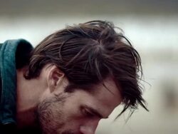 Backpacker resting at a lake Stock Footage