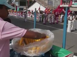 MS PAN Street vendor sells corn as Buddhist Perahera Festival parades past AUDIO / Hikkaduwa, Southern Province, Sri Lanka Stock Footage