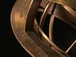An armillary sphere rotates against a black background. Stock Footage