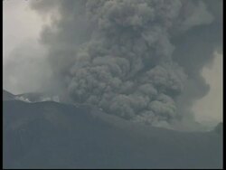 MS grey smoke and ash cloud billow from crater into sky, Mount Tunguragua, Ecuador Stock Footage
