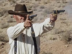 Slow motion of cowboy firing 2 pistols. Stock Footage