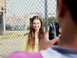 Female Teenager posing and male taking picture with digital camera Stock Footage