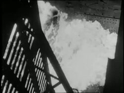 Factory workers work with molten metal. News Clip