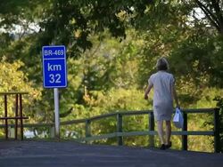 WS Tourist from CatarataÃ‚Â´s Park and kilometer sign / Foz do Iguacu, Parana, Brazil Stock Footage