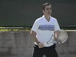 CU ECU a male tennis player hitting the tennis ball forehand and backhand. Stock Footage