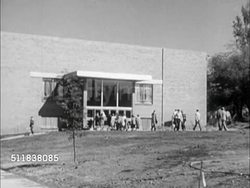 1950: DENVER, COLORADO: UNIVERSITY OF DENVER: WS Mary Reed Building w/ students walking FG. WS Students walking to modern square building. MS Students (many women) walking out/in building doors.   College, higher education, traditional, modern. Instructional Video