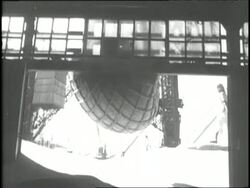 Grain pours from a net into a grain elevator. News Clip