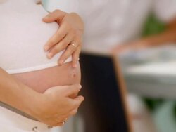 HD DOLLY: Pregnant Woman's Belly Stock Footage