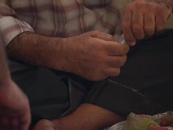 Anonymous man making up bombs in weapons factory News Clip