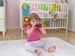 HD CRANE: Adorable Baby Girl Drinking Tea Stock Footage