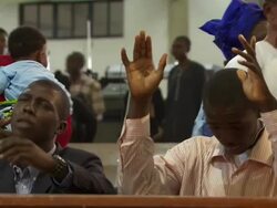 MS Shot of people praying with holding arms up in church / Lagos, Nigeria Stock Footage