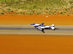 WS AERIAL DS ZI View of plane moving on runway near Uluru / Uluru National Park, Northen Territory, Australia Stock Footage
