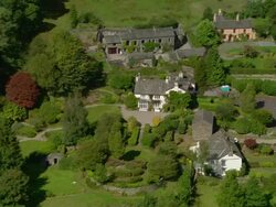 Aerial view of Rydal Mount (Wordsworth's Last Residence) and gardes near Ambleside in the Lake District / Cumbria, England Stock Footage