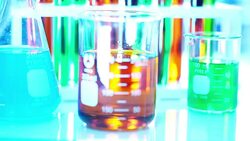 Dropping Orange liquid into eppendrof from auto pipette Stock Footage