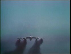 1960s low angle B-47 bomber flying over camera in blue sky / Cold War / documentary Stock Footage