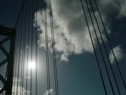 MS SLO MO POV Shot of driving over Bay Bridge looking up at top of bridge and sky /  San Francisco, California, United States Stock Footage