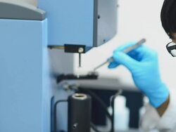 panning : Scientist men use forceps to hold pan in TGA Stock Footage