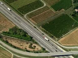 AERIAL, Motorway crossing green fields, Rhone-Alpes, France Stock Footage