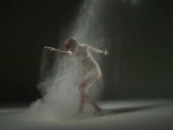 WS SLO MO Shot of nude female Caucasian, gets up and spins around powder is thrown at her / Studio, New York, United States Stock Footage