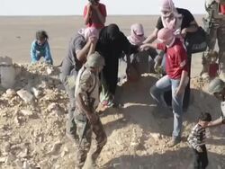 Syrian refugees assisted by Jordanian soldiers Stock Footage