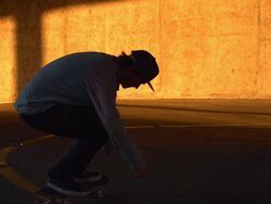 A young man skateboarding in a parking garage. - Slow Motion - filmed at 240 fps Stock Footage