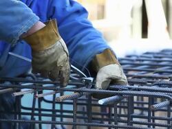 Worker Tying the Rebar on Constrution Site CU Stock Footage