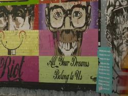 Graffiti Artwork on a busy corner of the Meatpacking District.  People and cars go past. Stock Footage