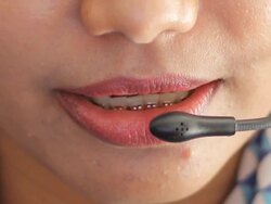 Businesswoman wearing headset using computer Stock Footage