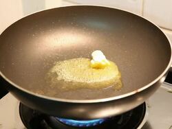 Butter Melting in Pan Stock Footage