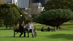 WS, Two business people meeting in park, office buildings in background, Sydney, Australia Stock Footage