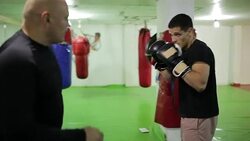 Two men having boxing workout indoors Stock Footage