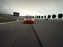 TS WS Racecar driving around curve on racetrack toward camera / Long Pond, Pennsylvania, USA Stock Footage