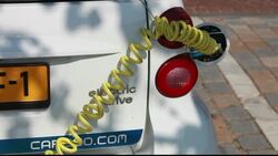 An electric car plugged into a recharging station in Ijburg, Amsterdam, Netherlands. Stock Footage