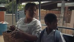 M/S Myanmar boy and mother in school bus Stock Footage