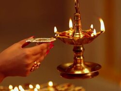 Close-up of a woman hand burning oil lamp Stock Footage