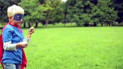 Little Superhero fighting in the park. Stock Footage