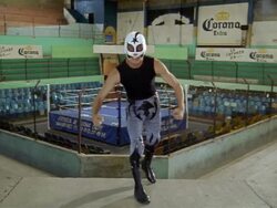Empty wrestling ring/ luchador 'Cometa Negro' jumping onto balcony and flexing muscles at CAM/ Mexico Stock Footage