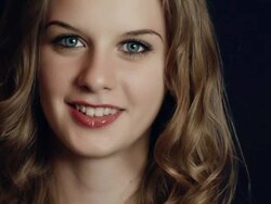 Young and beautiful blonde with blue eyes looking at camera Stock Footage