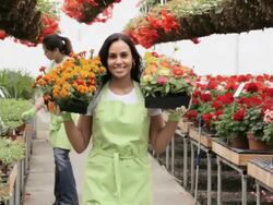 MS PAN Women walking in floral business  / Richmond, Virginia,United States Stock Footage