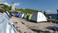 Syrian migrants fleeing the war and escaping to Europe, who have landed on the Greek island of Lesvos on the north coast at Efthalou and made their way to Mytilini. Up to 4,000 migrants a day are landing on the island and overwhelming the authorities. They Stock Footage
